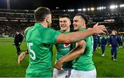 16 July 2022; Ireland players, from left, Hugo Keenan, Dan Sheehan and James Lowe embrace after their side's victory in the Steinlager Series match between the New Zealand and Ireland at Sky Stadium in Wellington, New Zealand. Photo by Brendan Moran/Sportsfile