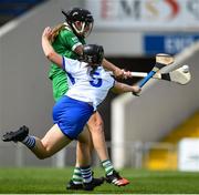 16 July 2022; Rebecca Delee of Limerick shoots to score her side's first goal despite the tackle of Orla Hickey of Waterford during the Glen Dimplex All-Ireland Senior Camogie Quarter Final match between  Waterford and Limerick at Semple Stadium in Thurles, Tipperary. Photo by George Tewkesbury/Sportsfile