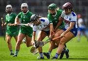 16 July 2022; Lorraine McCarthy of Limerick is tackled by Keeley Corbett Barry, left and Iona Heffernan of Waterford during the Glen Dimplex All-Ireland Senior Camogie Quarter Final match between  Waterford and Limerick at Semple Stadium in Thurles, Tipperary. Photo by George Tewkesbury/Sportsfile