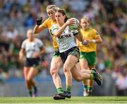 16 July 2022; Emma Troy of Meath in action against Yvonne Bonner of Donegal during the TG4 All-Ireland Ladies Football Senior Championship Semi-Final match between Donegal and Meath at Croke Park in Dublin. Photo by Stephen McCarthy/Sportsfile