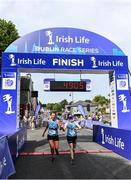 17 July 2022; Ingrid Brangan, left, and Jennifer Co, cross the line during the Irish Life Dublin Race Series Fingal 10K in Swords, Dublin. Photo by Harry Murphy/Sportsfile