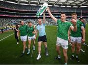 17 July 2022; Limerick players, from left, Séamus Flanagan, Mike Casey, Cian Lynch and Diarmaid Byrnes celebrate with the Liam MacCarthy Cup after the GAA Hurling All-Ireland Senior Championship Final match between Kilkenny and Limerick at Croke Park in Dublin. Photo by Stephen McCarthy/Sportsfile