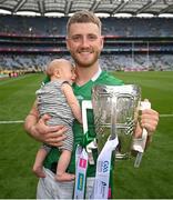 17 July 2022; Séamus Flanagan of Limerick and his 12-week-old son Freddie celebrates with the Liam MacCarthy Cup after the GAA Hurling All-Ireland Senior Championship Final match between Kilkenny and Limerick at Croke Park in Dublin. Photo by Stephen McCarthy/Sportsfile