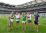 17 July 2022; Limerick players and their children, from left, Charlie Carey, nephew of Cian Lynch, with, Séamus Flanagan and his son Freddie, Barry Hennessy and his daughter Hope, Graeme Mulcahy and his daughter Róise, Nickie Quaid and his son Dáithí and selector Paul Kinnerk and his daughter Enya after their side's victory in the GAA Hurling All-Ireland Senior Championship Final match between Kilkenny and Limerick at Croke Park in Dublin. Photo by Harry Murphy/Sportsfile