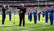 17 July 2022; Amhrán na bhFiann is performed by the Artane band while being signed by Senan Dunne during the GAA Hurling All-Ireland Senior Championship Final match between Kilkenny and Limerick at Croke Park in Dublin. Photo by Eóin Noonan/Sportsfile