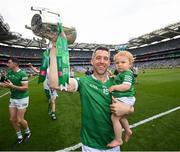 17 July 2022; Graeme Mulcahy of Limerick and one year old Róise celebrate with the Liam MacCarthy Cup after the GAA Hurling All-Ireland Senior Championship Final match between Kilkenny and Limerick at Croke Park in Dublin. Photo by Stephen McCarthy/Sportsfile