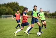 18 July 2022; Mia Fitzpatrick, left, and Emily Duffy during a game hosted by Republic of Ireland women's team manager Vera Pauw on her visit to the INTERSPORT Elverys FAI Summer Soccer Schools Camp at PRL Park in Greenogue, Dublin. Photo by Stephen McCarthy/Sportsfile
