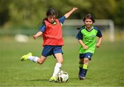 18 July 2022; Mia Fitzpatrick, left, and Athena Fitzgerald Grant during a game hosted by Republic of Ireland women's team manager Vera Pauw on her visit to the INTERSPORT Elverys FAI Summer Soccer Schools Camp at PRL Park in Greenogue, Dublin. Photo by Stephen McCarthy/Sportsfile