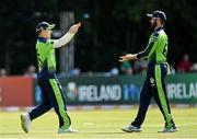18 July 2022; Curtis Campher, right, celebrates a catch with Ireland teammate Andrew Balbirnie during the Men's T20 International match between Ireland and New Zealand at Stormont in Belfast. Photo by Ramsey Cardy/Sportsfile