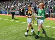 17 July 2022; Mascots and Cuala GAA players Oleksardz Rosolvych and Dasha Harbarchuk bring out the Liam MacCarthy Cup before the GAA Hurling All-Ireland Senior Championship Final match between Kilkenny and Limerick at Croke Park in Dublin. Photo by Seb Daly/Sportsfile