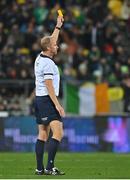 16 July 2022; Referee Wayne Barnes issues a yellow card to Andrew Porter of Ireland, not pictured, during the Steinlager Series match between the New Zealand and Ireland at Sky Stadium in Wellington, New Zealand. Photo by Brendan Moran/Sportsfile