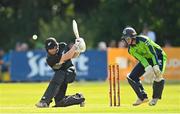 18 July 2022; Glenn Phillips of New Zealand and Ireland wicketkeeper Lorcan Tucker during the Men's T20 International match between Ireland and New Zealand at Stormont in Belfast. Photo by Ramsey Cardy/Sportsfile