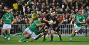 16 July 2022; Sam Cane of New Zealand is tackled by Jonathan Sexton and Jamison Gibson Park of Ireland during the Steinlager Series match between the New Zealand and Ireland at Sky Stadium in Wellington, New Zealand. Photo by Brendan Moran/Sportsfile