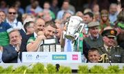 17 July 2022; Charlie Carey, right, and Limerick's Séamus Flanagan and his son Freddie lift the Liam MacCarthy Cup after the GAA Hurling All-Ireland Senior Championship Final match between Kilkenny and Limerick at Croke Park in Dublin. Photo by Stephen McCarthy/Sportsfile