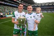 17 July 2022; Limerick goalkeepers Nickie Quaid and Barry Hennessy with his daughter Hope celebrate with the Liam MacCarthy Cup after the GAA Hurling All-Ireland Senior Championship Final match between Kilkenny and Limerick at Croke Park in Dublin. Photo by Stephen McCarthy/Sportsfile
