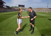 17 July 2022; Saoirse Fíobhuí, Scoil Lorcáín, An Charraig Dhubh, Átha Cliath, brings the sliothár to referee Colm Lyons before the the GAA Hurling All-Ireland Senior Championship Final match between Kilkenny and Limerick at Croke Park in Dublin. Photo by Stephen McCarthy/Sportsfile