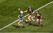 17 July 2022; Lucy Beecher, Scoil Mháirtín, Kilworth, Cork, representing Limerick, in action against Saoirse Fíobhuí, Scoil Lorcáín, An Charraig Dhubh, Co. Átha Cliath, left, and Abby Fitzpatrick, Paddock N.S., Mountrath, Portlaoise, Laois, representing Kilkenny, during the INTO Cumann na mBunscol GAA Respect Exhibition Go Games at half-time of the GAA All-Ireland Senior Hurling Championship Final match between Kilkenny and Limerick at Croke Park in Dublin. Photo by Daire Brennan/Sportsfile