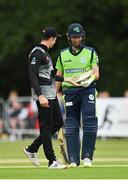 20 July 2022; Ireland captain Andrew Balbirnie and Mitchell Santner of New Zealand inspect the broken bat of Ireland's Paul Stirling during the Men's T20 International match between Ireland and New Zealand at Stormont in Belfast. Photo by Seb Daly/Sportsfile