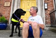 21 July 2022; Duncan Hughes and his Parkinson dog Leon at the launch of Dublin Neurological Institute Virtual 5km Fun Run to be held on July 31st. The DNI is a registered charity who care for patients with neurological diseases including Parkinson, Epilepsy, Motor Neuron Disease, Multiple Sclerosis, Headache, Stroke. Photo by David Fitzgerald/Sportsfile