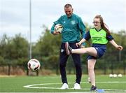 21 July 2022; Republic of Ireland U21s Manager Jim Crawford and participant Sarah Blake during his visit to the Football For All Summer Soccer School at St Patrick's Boys AFC in Carlow. Photo by Seb Daly/Sportsfile