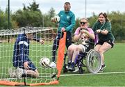 21 July 2022; Republic of Ireland U21s Manager Jim Crawford with participant Mairead Hanlon, and coach Shannen Cotter during his visit to the Football For All Summer Soccer School at St Patrick's Boys AFC in Carlow. Photo by Seb Daly/Sportsfile