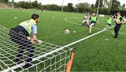 21 July 2022; Participant Sarah Blake and Gardaí Frank Bergin and Essmay Murphy during the Football For All Summer Soccer School at St Patrick's Boys AFC in Carlow. Photo by Seb Daly/Sportsfile