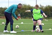 21 July 2022; Republic of Ireland U21s Manager Jim Crawford with participant Ava Crampton during his visit to the Football For All Summer Soccer School at St Patrick's Boys AFC in Carlow. Photo by Seb Daly/Sportsfile