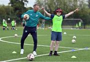 21 July 2022; Republic of Ireland U21s Manager Jim Crawford and participant Aaron O'Reilly during his visit to the Football For All Summer Soccer School at St Patrick's Boys AFC in Carlow. Photo by Seb Daly/Sportsfile