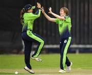 21 July 2022; Georgina Dempsey of Ireland, right, celebrates with team mate Cara Murrary after taking their sides first wicket during the Women's T20 International match between Ireland and Australia at Bready Cricket Club in Bready, Tyrone. Photo by George Tewkesbury/Sportsfile