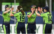 21 July 2022; Arlene Kelly of Ireland, centre, celebrates with team mates Georgina Dempsey, left, Rachel Delaney and Laura Delany during the Women's T20 International match between Ireland and Australia at Bready Cricket Club in Bready, Tyrone. Photo by George Tewkesbury/Sportsfile