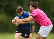 21 July 2022; James Fitzpatrick is tackled by Luke Meijer during the Bank of Ireland Leinster Rugby School of Excellence at The King's Hospital School in Dublin. Photo by Harry Murphy/Sportsfile