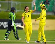 21 July 2022; Megan Schutt of Australia celebrates with team mate Meg Lanning after she takes her sides fifth wicket during the Women's T20 International match between Ireland and Australia at Bready Cricket Club in Bready, Tyrone. Photo by George Tewkesbury/Sportsfile