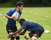 21 July 2022; Duane Moss is tackled by Michalack Tsiebos during the Bank of Ireland Leinster Rugby School of Excellence at The King's Hospital School in Dublin. Photo by Harry Murphy/Sportsfile