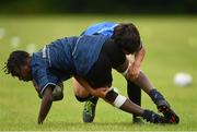 21 July 2022;  Michalack Tsiebos is tackled by Duane Moss during the Bank of Ireland Leinster Rugby School of Excellence at The King's Hospital School in Dublin. Photo by Harry Murphy/Sportsfile