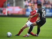 21 July 2022; Eoin Doyle of St Patrick's Athletic in action against Darrick Morris of Mura during the UEFA Europa Conference League 2022/23 Second Qualifying Round First Leg match between St Patrick's Athletic and NS Mura at Richmond Park in Dublin. Photo by Stephen McCarthy/Sportsfile