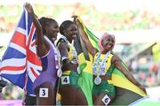 21 July 2022; Shericka Jackson of Jamaica, centre, who won gold, Shelly-Ann Fraser-Pryce of Jamaica, right, who won silver, and Dina Asher-Smith of Great Britain, who won bronze, celebrate after the Women's 200m final during day seven of the World Athletics Championships at Hayward Field in Eugene, Oregon, USA. Photo by Sam Barnes/Sportsfile