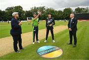 22 July 2022; Ireland captain Andrew Balbirnie performs the coin toss, in the company of presenter Craig McMillan, New Zealand captain Mitchell Santner and match referee Graham McCrea before the Men's T20 International match between Ireland and New Zealand at Stormont in Belfast. Photo by Ramsey Cardy/Sportsfile