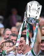 17 July 2022; Limerick goalkeeper Nickie Quaid lifts the Liam MacCarthy Cup with 17-month-old Daithi Quaid after the GAA Hurling All-Ireland Senior Championship Final match between Kilkenny and Limerick at Croke Park in Dublin. Photo by Piaras Ó Mídheach/Sportsfile