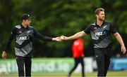 22 July 2022; Mitchell Santner, left, and Jimmy Neesham of New Zealand during the Men's T20 International match between Ireland and New Zealand at Stormont in Belfast. Photo by Ramsey Cardy/Sportsfile