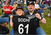 22 July 2022; New Zealand supporters Poppy Blackmore, age 6, and her dad Phil, after receiving a match jersey from Ish Sodhi of New Zealand, during the Men's T20 International match between Ireland and New Zealand at Stormont in Belfast. Photo by Ramsey Cardy/Sportsfile