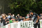 22 July 2022; Ish Sodhi of New Zealand signs autographs during the Men's T20 International match between Ireland and New Zealand at Stormont in Belfast. Photo by Ramsey Cardy/Sportsfile