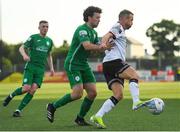 22 July 2022; Keith Ward of Dundalk in action against Barry McNamee of Finn Harps during the SSE Airtricity League Premier Division match between Dundalk and Finn Harps at Oriel Park in Dundalk, Louth. Photo by George Tewkesbury/Sportsfile