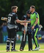 22 July 2022; Jimmy Neesham of New Zealand and Mark Adair of Ireland shake hands after the Men's T20 International match between Ireland and New Zealand at Stormont in Belfast. Photo by Ramsey Cardy/Sportsfile
