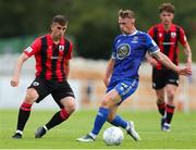 22 July 2022; Darragh Power of Waterford in action against Dean McMenamy of Longford Town during the SSE Airtricity League First Division match between Waterford and Longford Town at RSC in Waterford. Photo by Michael P Ryan/Sportsfile