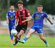 22 July 2022; Niall O'Keeffe of Waterford in action against Brandon McCann of Longford Town during the SSE Airtricity League First Division match between Waterford and Longford Town at RSC in Waterford. Photo by Michael P Ryan/Sportsfile