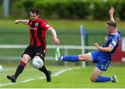 22 July 2022; Michael Barker of Longford Town, left, in action against Darragh Power of Waterford during the SSE Airtricity League First Division match between Waterford and Longford Town at RSC in Waterford. Photo by Michael P Ryan/Sportsfile