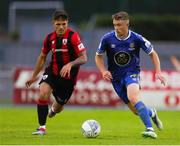 22 July 2022; Darragh Power of Waterford in action against Karl Chambers of Longford Town during the SSE Airtricity League First Division match between Waterford and Longford Town at RSC in Waterford. Photo by Michael P Ryan/Sportsfile