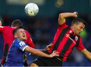 22 July 2022; Cian Kavanagh of Waterford in action against Darren Clarke of Longford Town during the SSE Airtricity League First Division match between Waterford and Longford Town at RSC in Waterford. Photo by Michael P Ryan/Sportsfile