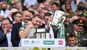 17 July 2022; Charlie Carey, right, and Limerick's Séamus Flanagan and his son Freddie lift the Liam MacCarthy Cup after the GAA Hurling All-Ireland Senior Championship Final match between Kilkenny and Limerick at Croke Park in Dublin. Photo by Piaras Ó Mídheach/Sportsfile