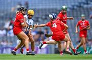 23 July 2022; Niamh Rockett of Waterford is tackled by Laura Hayes, left, and Meabh Cahalane of Cork during the Glen Dimplex Senior Camogie All-Ireland Championship Semi-Final match between Cork and Waterford at Croke Park in Dublin. Photo by Piaras Ó Mídheach/Sportsfile